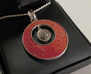 Own a piece of Mars with this Martian meteorite granule pendant from the Space Store! Enter our giveaway for details.