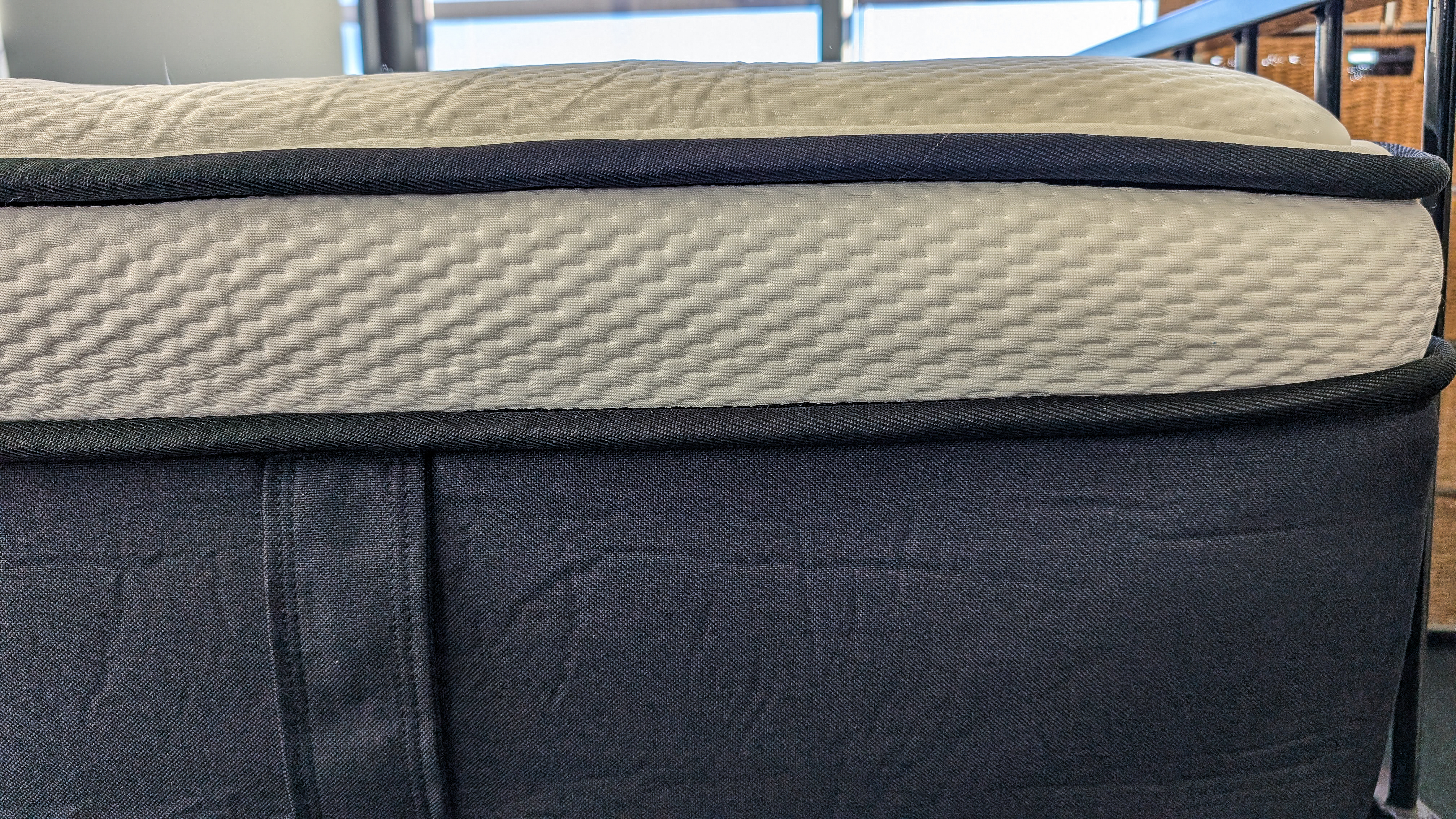 A fabric handle on the side of the Origin LumbarCloud mattress