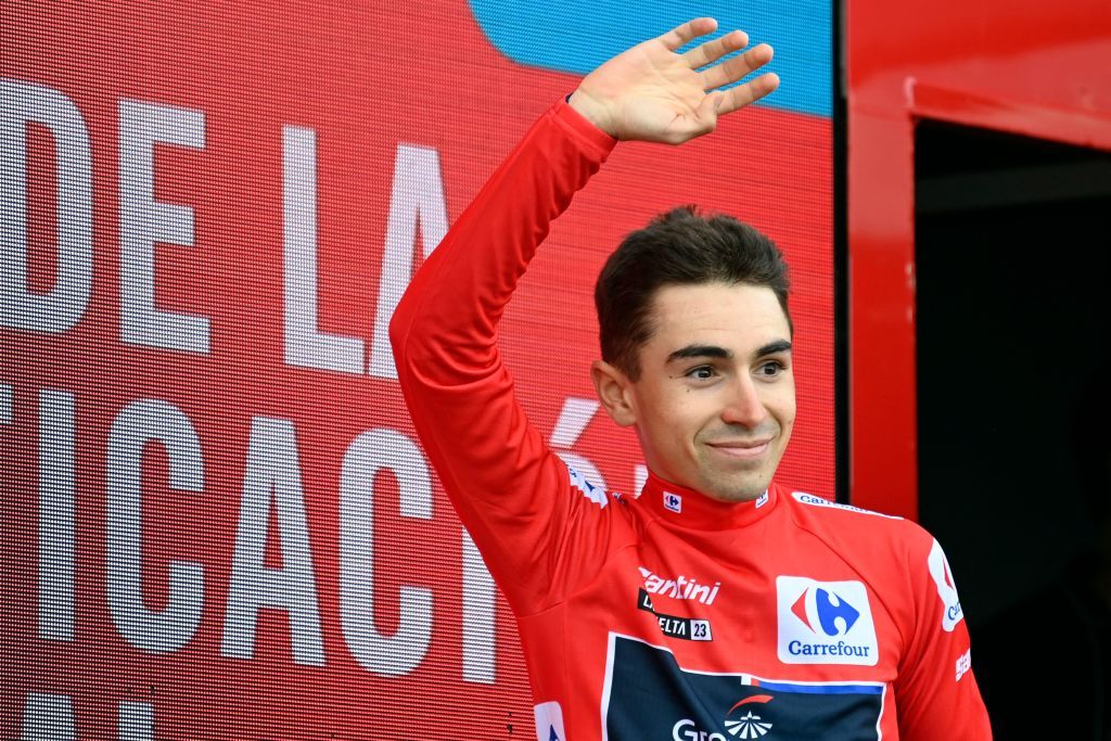 The new overall leader Team GroupamaFdjs French rider Lenny Martinez celebrates on the podium wearing the red jersey after the sixth stage of the 2023 La Vuelta cycling tour of Spain a 1831 km race from La Vall dUixo to Alto de Javalambre on August 31 2023 Photo by JOSE JORDAN AFP Photo by JOSE JORDANAFP via Getty Images