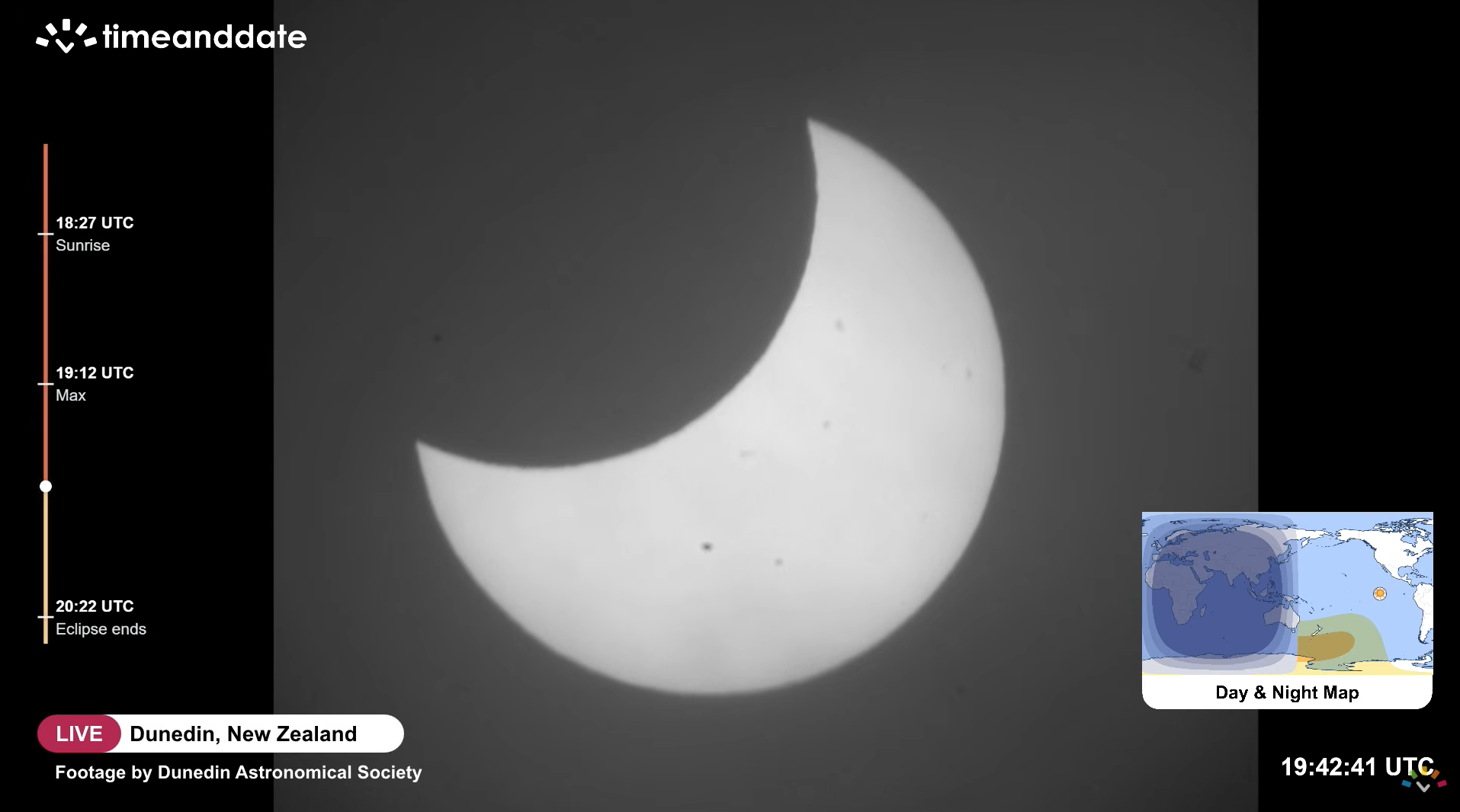 A picture of the sun's disk with its left side blocked by the curved outline of the moon's silhouette.
