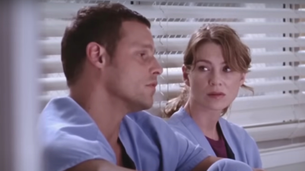 Justin Chambers sitting and talking to Ellen Pompeo on Grey's Anatomy