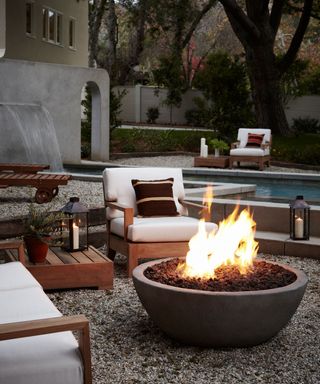 fire pit in a garden with outdoor seating