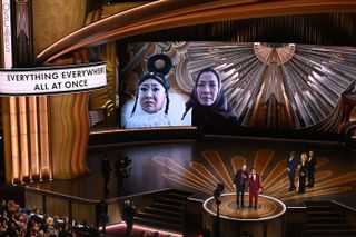 Oscars 2023 stage with directors of everything everywhere all at once accepting the award