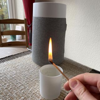 Blueair Blue Pure Mini Max Air Purifier behind lit match during smoke test