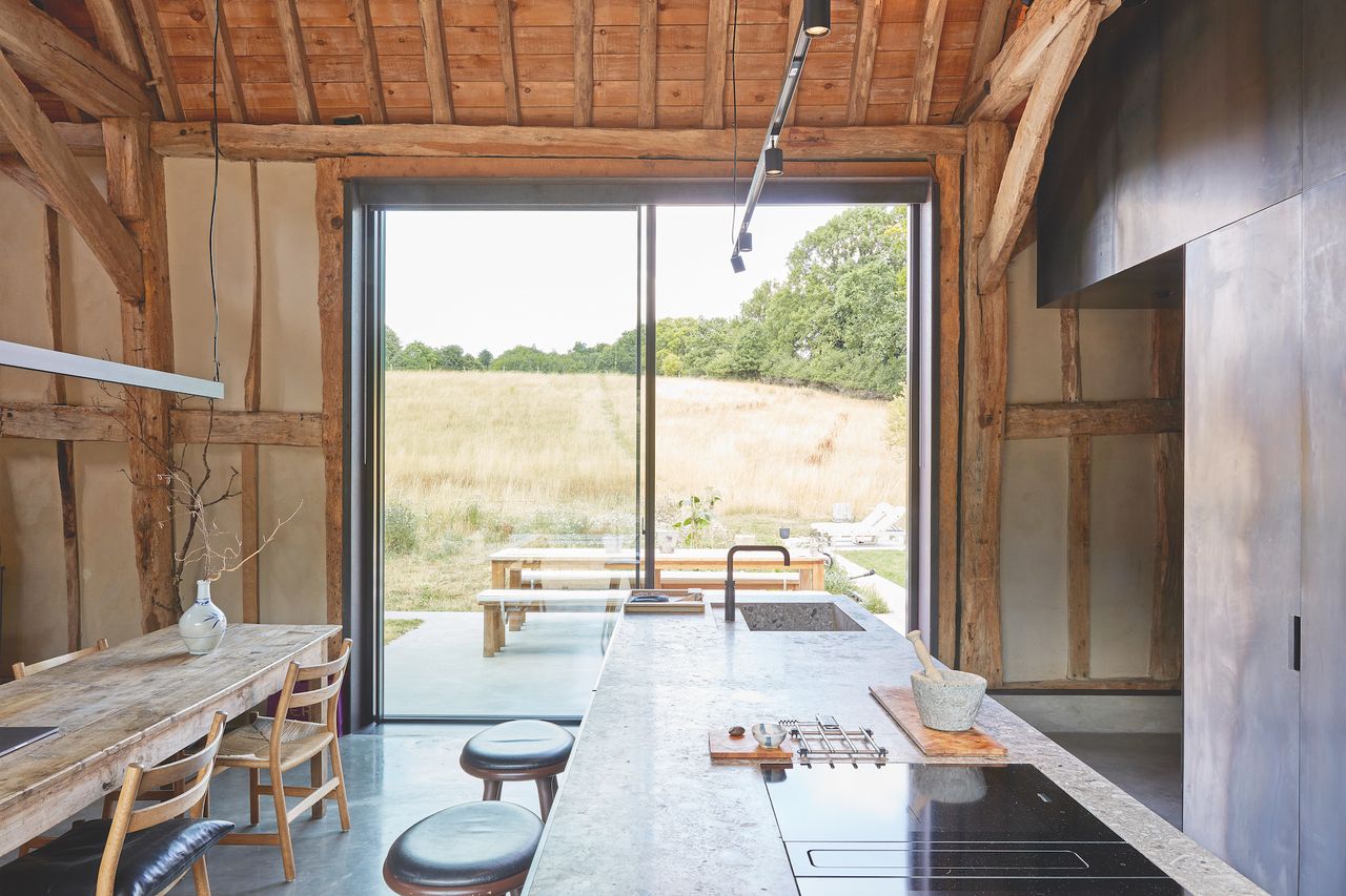 kitchen with concrete island and view to garden
