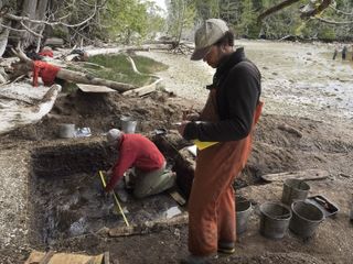 Duncan McLaren (right) and Daryl Fedje (left) excavate the site on Calvert Island.