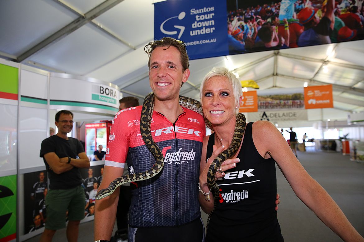 Koen de Kort and Trek Segafredo hospitality manager Nathalie Desmarets with a snake