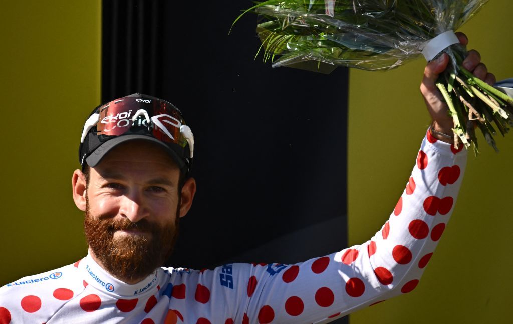 Cofidis teams German rider Simon Geschke celebrates on the podium with the climbers dotted jersey after the 14th stage of the 109th edition of the Tour de France cycling race 1925 km between SaintEtienne and Mende in central France on July 16 2022 Photo by Marco BERTORELLO AFP Photo by MARCO BERTORELLOAFP via Getty Images
