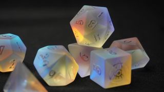 A shot of iridescent dice on a black background