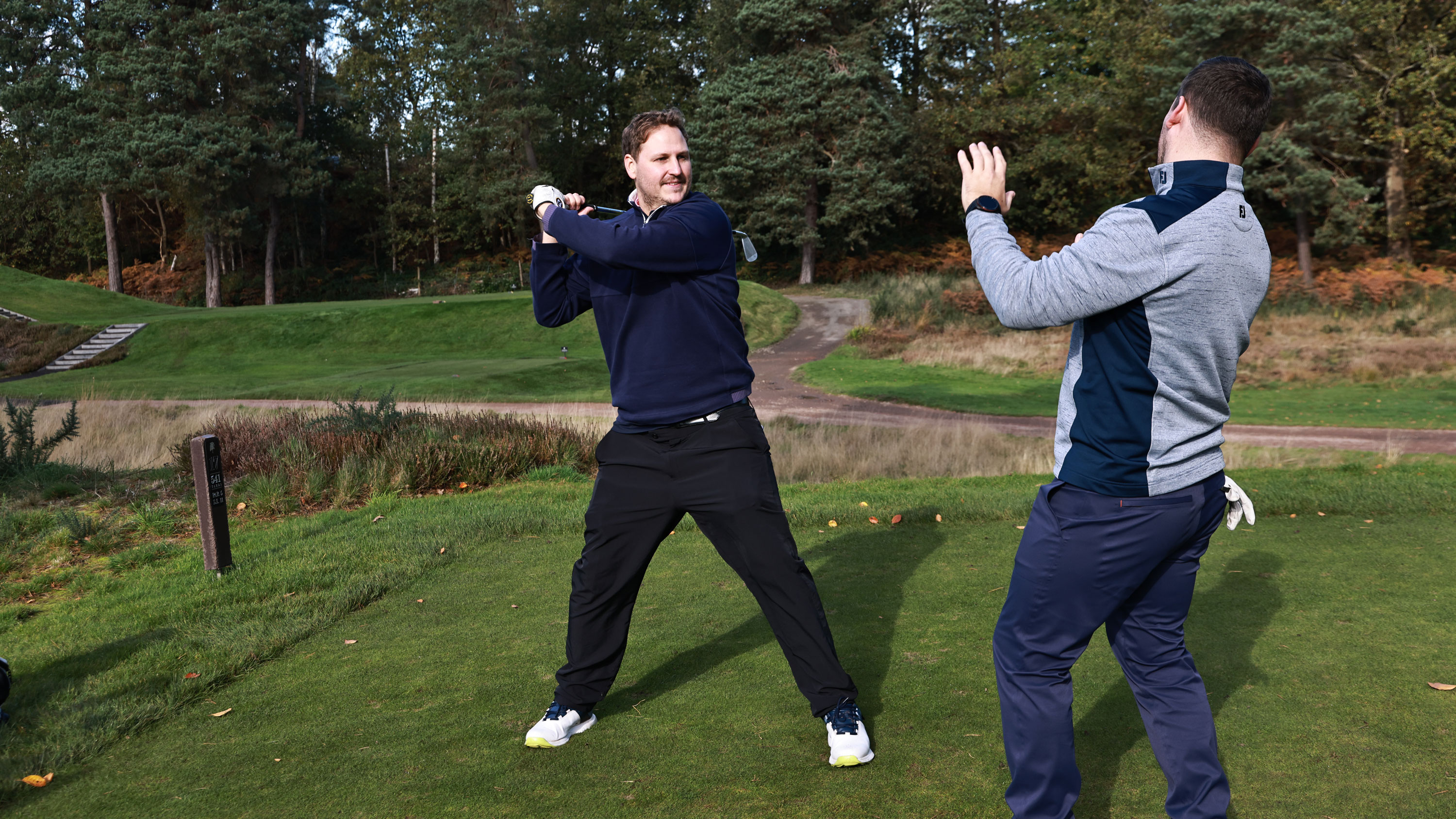 A golfer reacts angrily when he is asked to replay a shot