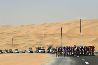 MADINAT ZAYED UNITED ARAB EMIRATES FEBRUARY 20 A general view of the Peloton passing through the desert during the 4th UAE Tour 2022 Stage 1 a 184km stage from Madinat Zayed to Madinat Zayed UAETour WorldTour on February 20 2022 in Madinat Zayed United Arab Emirates Photo by Tim de WaeleGetty Images