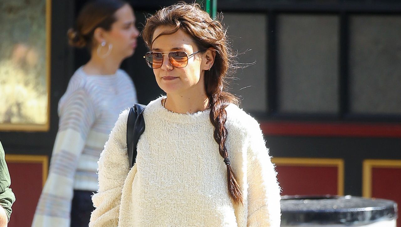 Katie Holmes walks in New York City wearing the Mary Janes trend and a cuddly white sweater