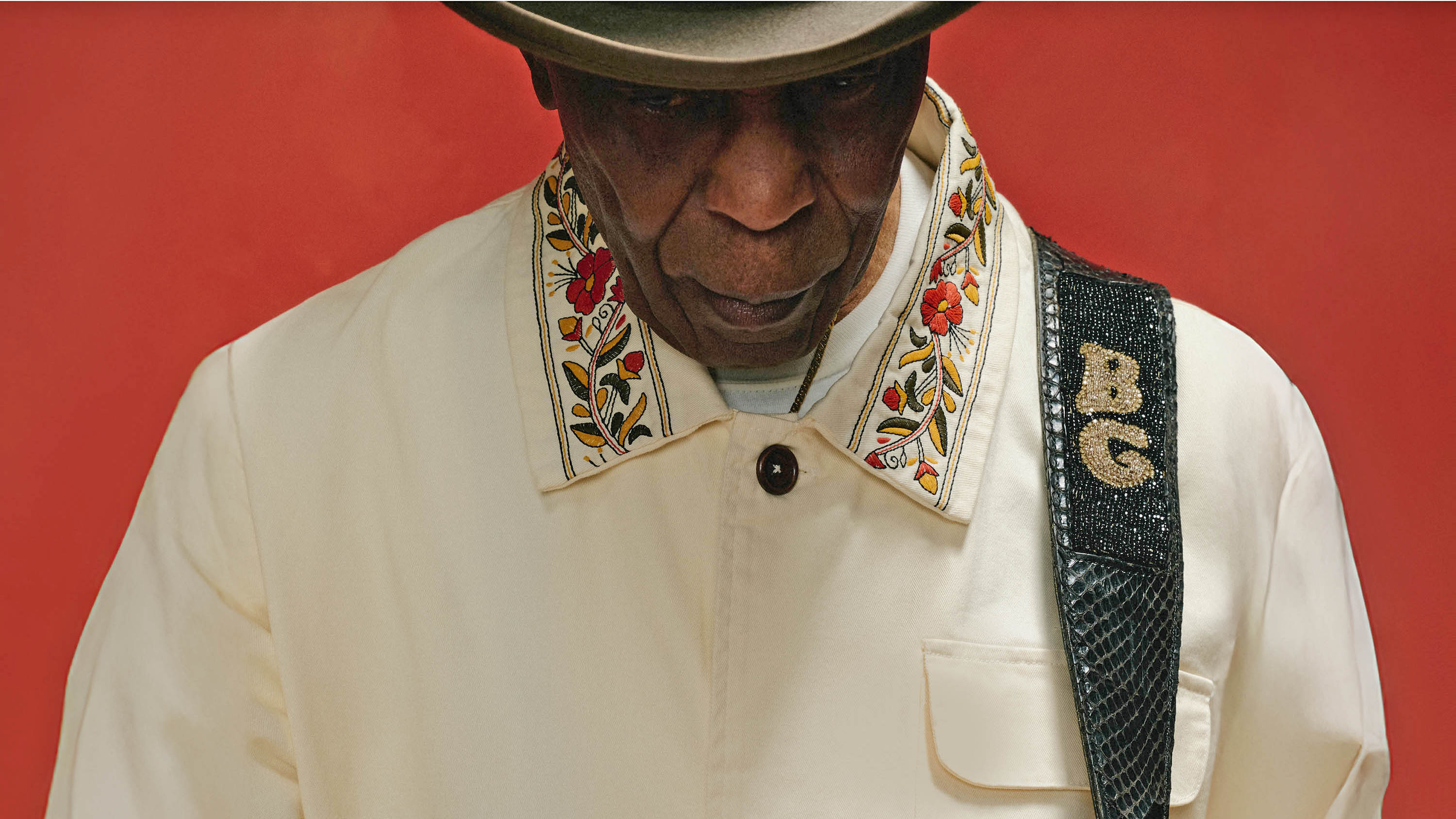 A photo Buddy Guy in closeup showing him from the chest up