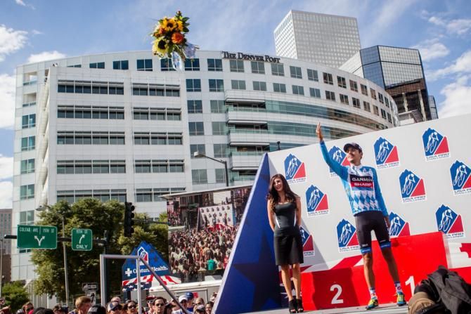 Lachlan Morton (Garmin-Sharp) throws floors to the crowd after taking his final best young rider jersey.