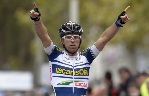 Marco Marcato (Vacansoleil-DCM Pro Cycling Team) celebrates with his arms in the air