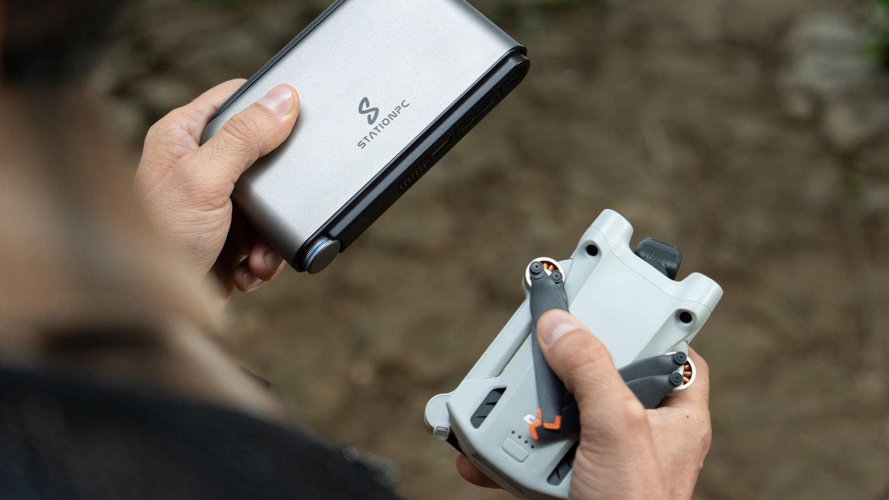 A lifestyle image of the PocketCloud with a DJI drone