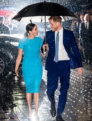 prince harry meghan markle iconic umbrella photo circumstances revealed