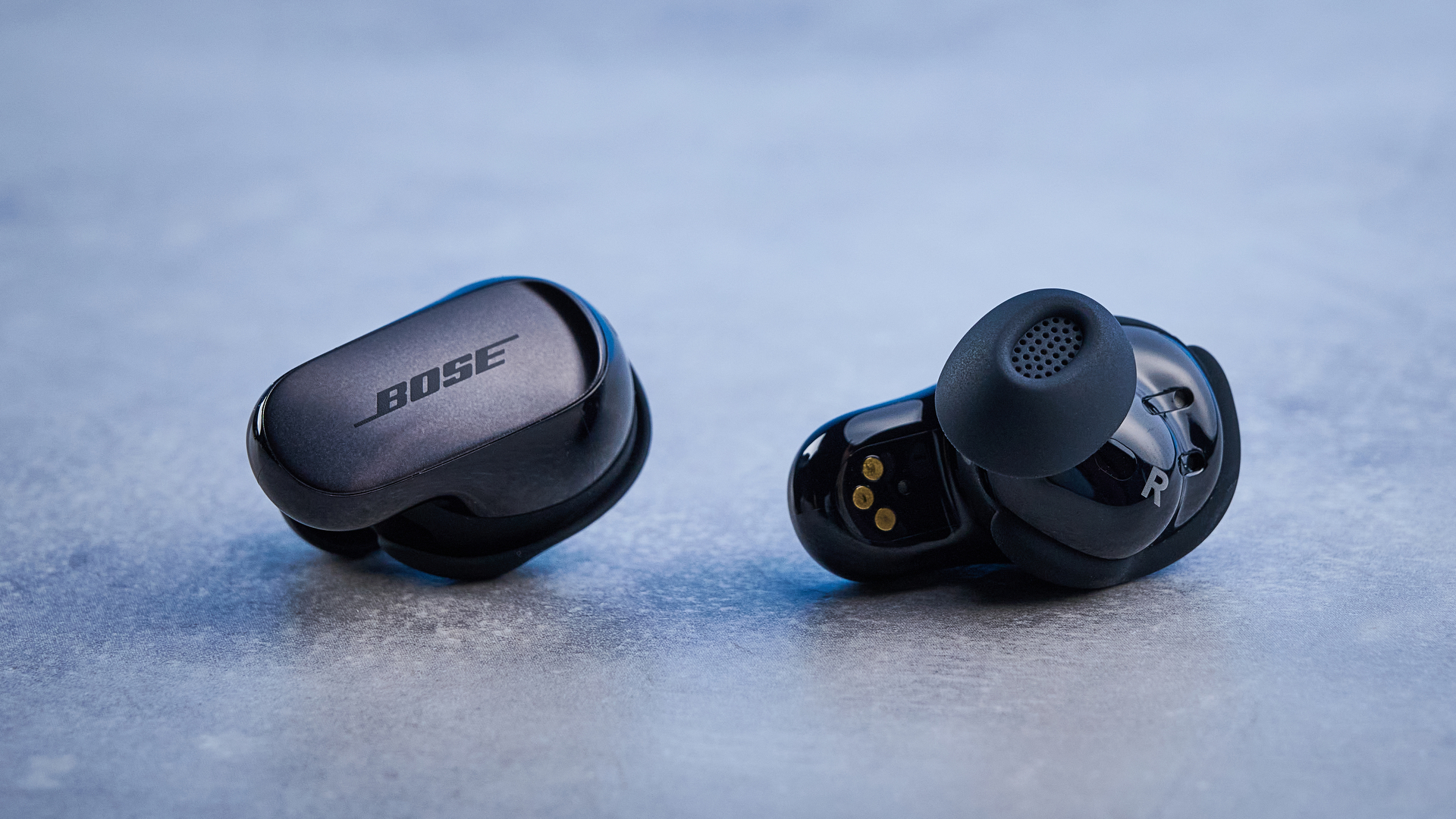 the bose quietcomfort ultra earbuds 2nd gen against the blue tom's guide background