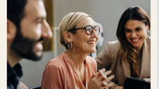 Whitepaper cover with image of multi generation colleagues smiling together at table