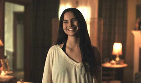 Inde Navarette as Nikki smiling after Bear leaves for work in Obsession