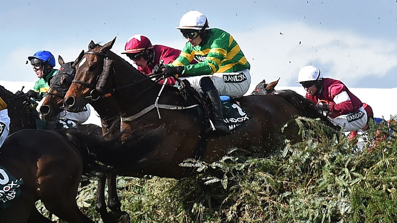 Jockey Paul Townend and I Am Maximus jump The Chair on the way to winning the Grand National at Aintree Racecourse on 11 April 2026. (Photo by PETER POWELL / AFP)