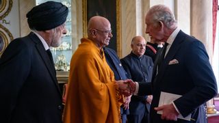King Charles III meets with faith leaders during a reception at Buckingham Palace