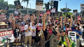 Tom Morello, pictured on the Hollywood picket line with striking WGA and SAG-AFTRA members