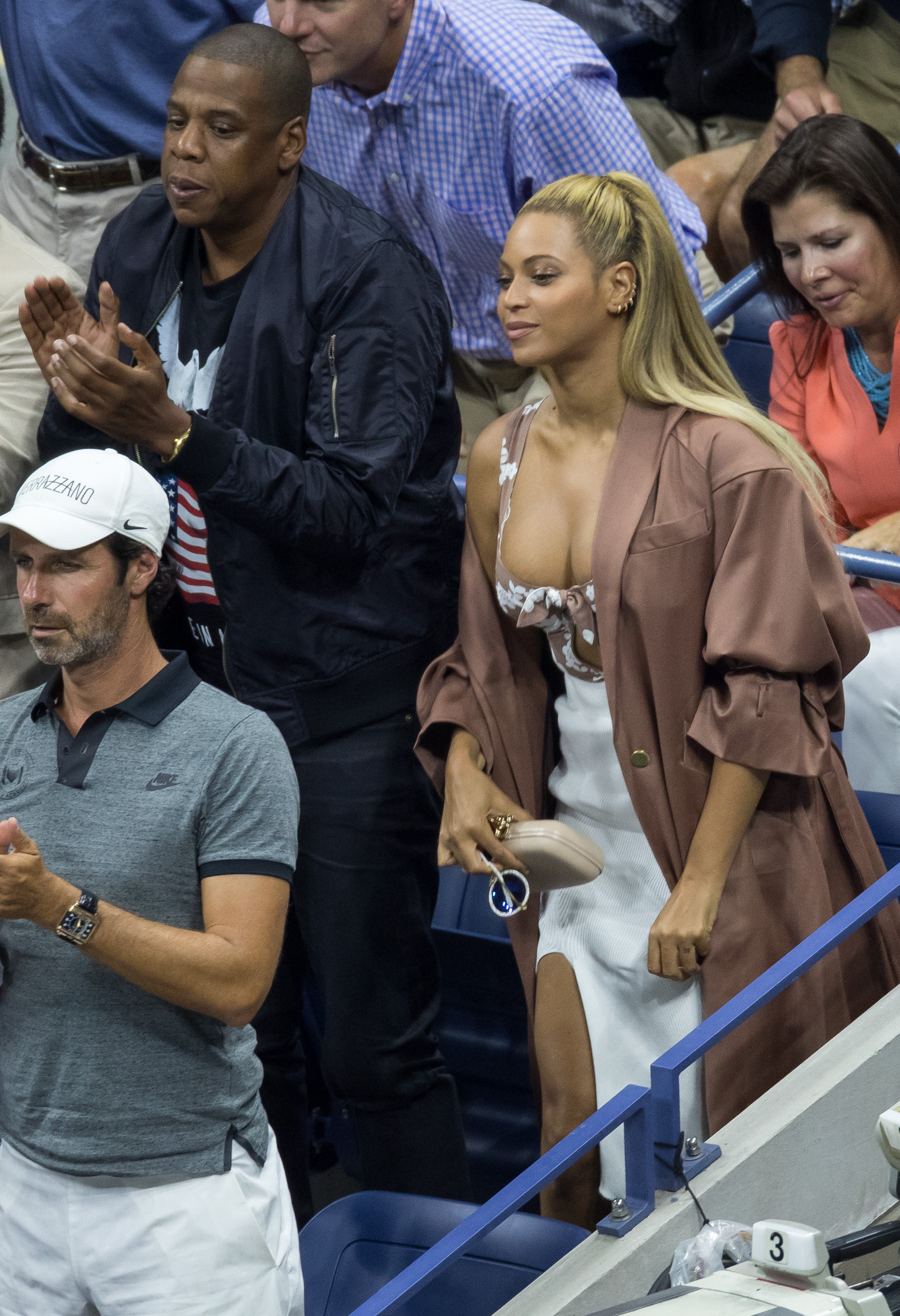 Beyoncé attended the 2016 US Open in a printed skirt set and a matching trench coat
