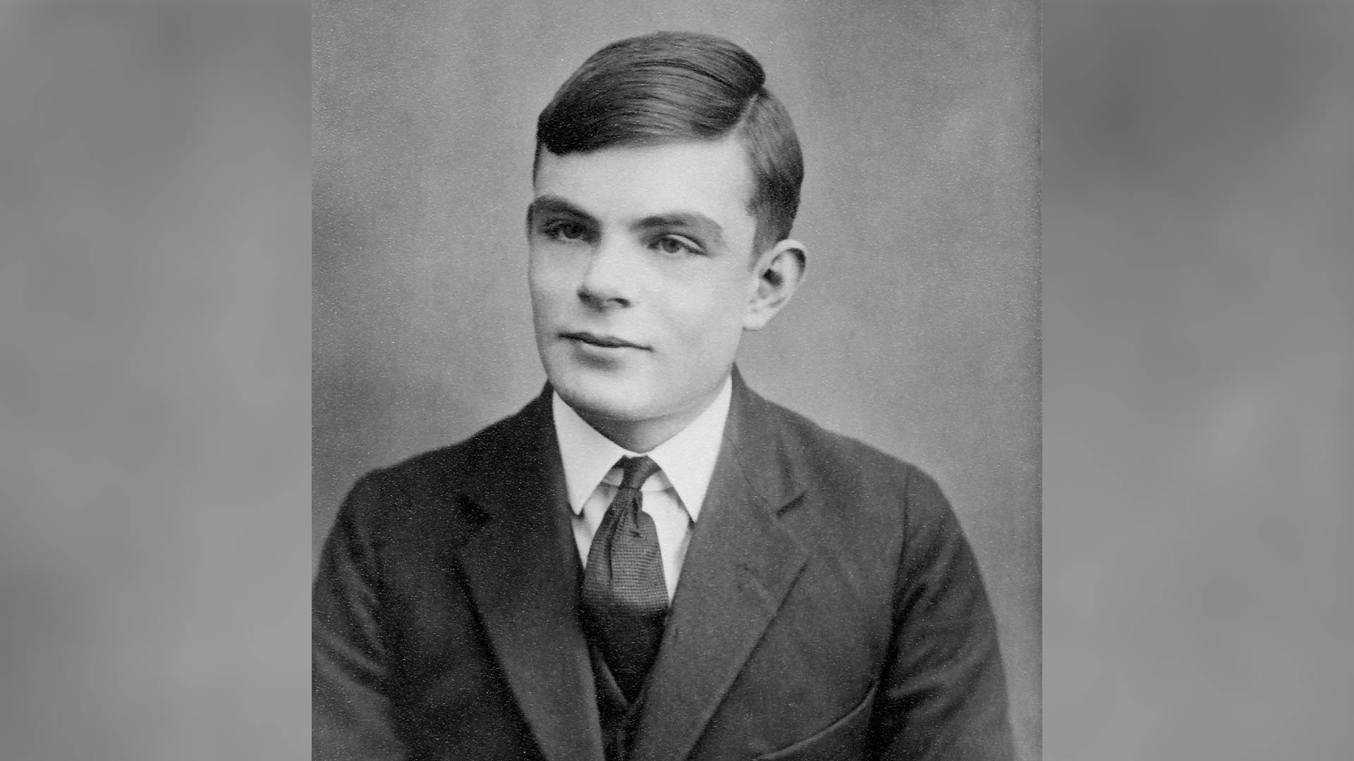 A black and white photo of Alan Turing