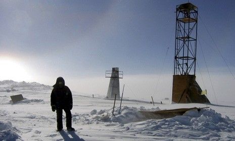 A 2006 image of a man at the Vostock research camp in Antartica: Researchers have finally drilled the prehistoric sub-glacier lake after 20 years of trying.