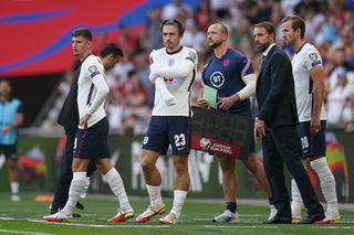 England substitutes Mason Mount (left), Jack Grealish (centre) and Harry Kane prepare to come on
