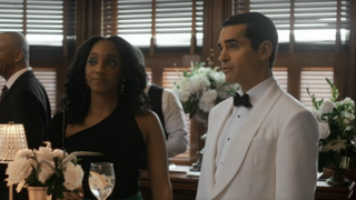Iantha Richardson as Faith and Ramon Rodriguez as Will Trent at a wedding in Will Trent Season 2x07