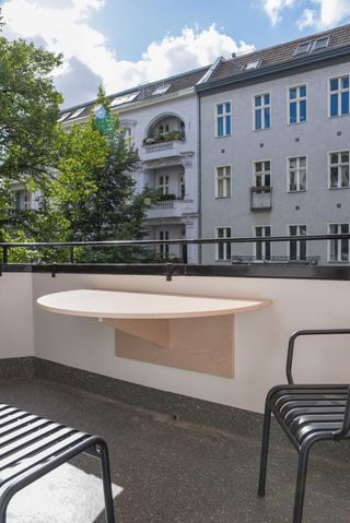 a balcony with a fold down table