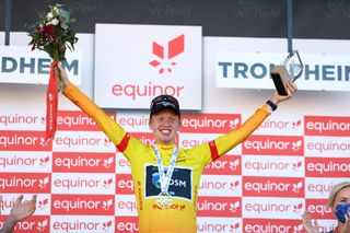 Andreas Leknessund (Team DSM) celebrates his overall victory on the podium after the Arctic Race of Norway