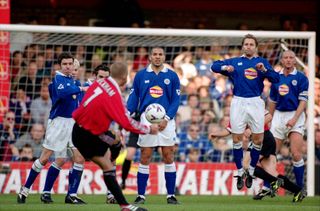 David Beckham scores a free-kick for Manchester United against Leicester in 2000.