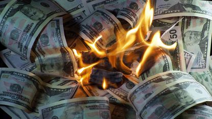 burning dollars representing inflation