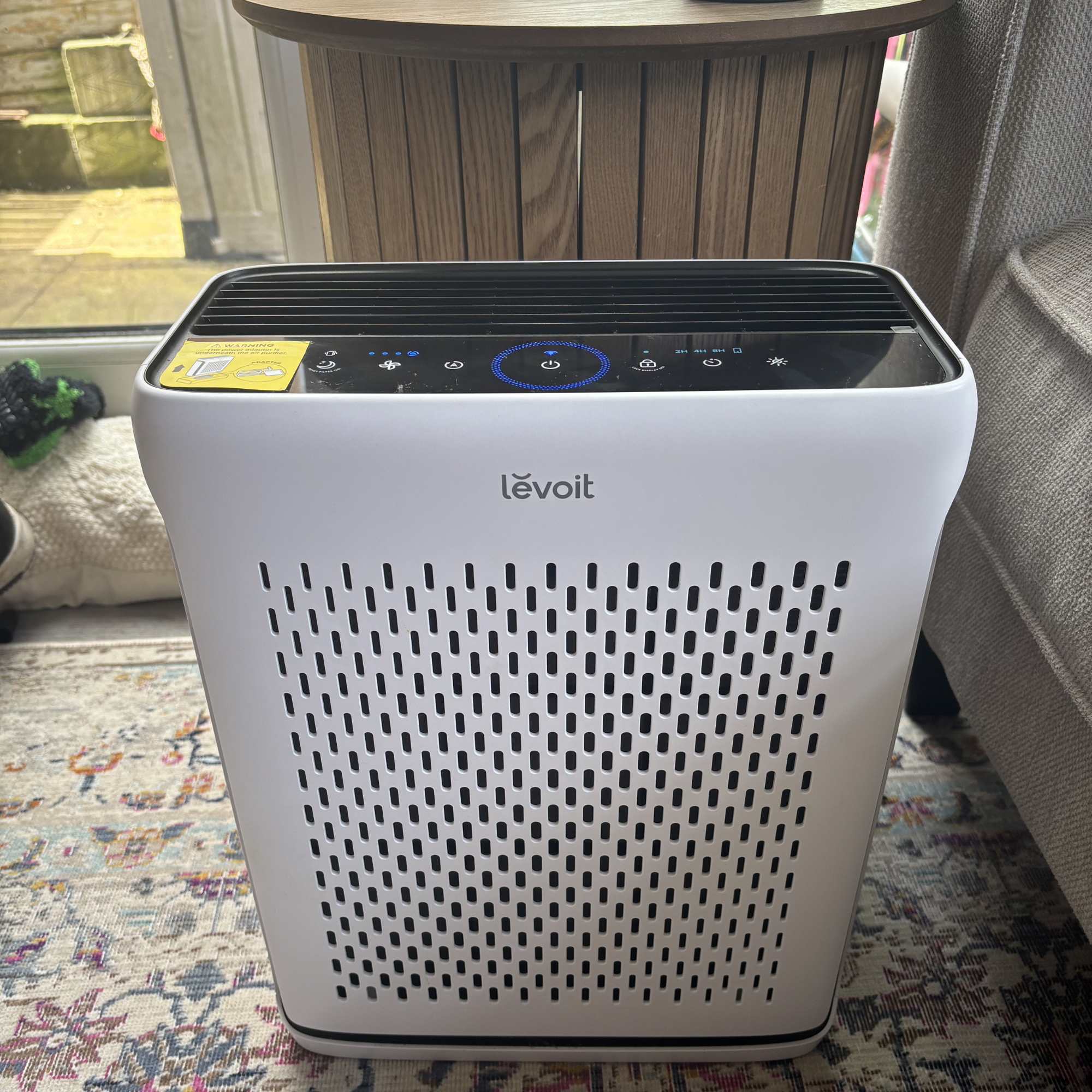 Levoit Vital 100S Smart Air Purifier on patterned rug