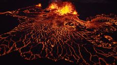 lava flowing from a central source on a black background 