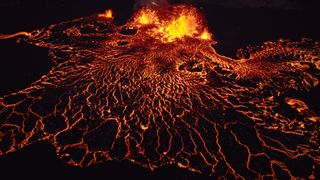 lava flowing from a central source on a black background 