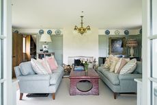 panelled_living_room_with_two_sofas_blue_teal