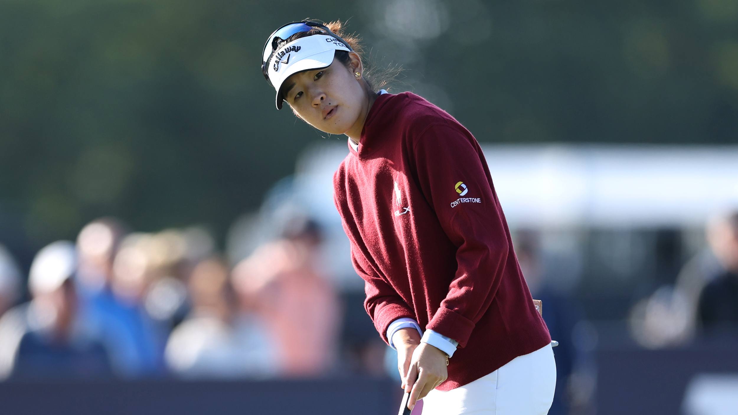 Andrea Lee looks on after hitting a putt at the AIG Women's Open