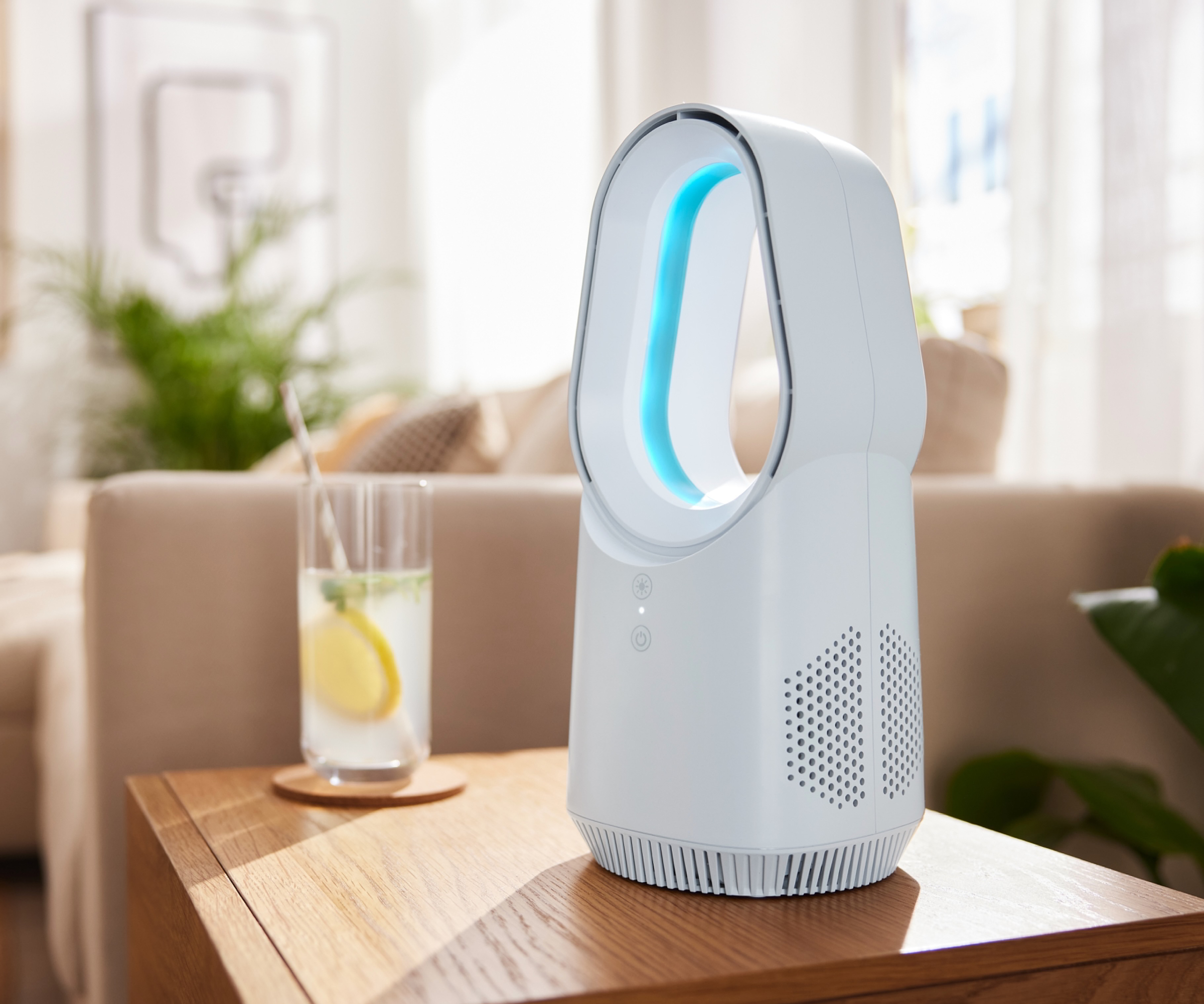 bladeless table top tower fan on wooden side table in living room