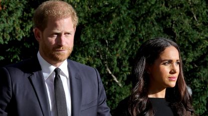 Meghan Markle and Prince Harry wear black as they view tributes at Windsor Castle to Queen Elizabeth, who died on September 8, 2022