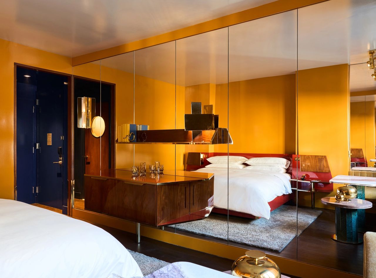The 1980s-inspired interiors of New York's new hotel, The Manner, pair seemingly disparate shades of yellow, blue, and red into a captivating color scheme.