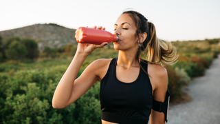 Woman drinking bottle of water