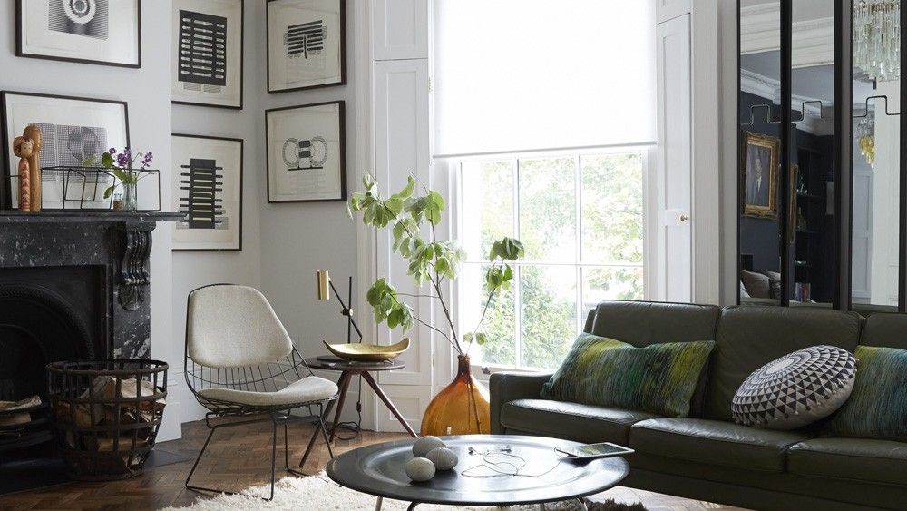 living room with black fire place and white wall