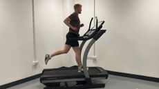 Our expert fitness reviewer testing the NordicTrack x22i treadmill 