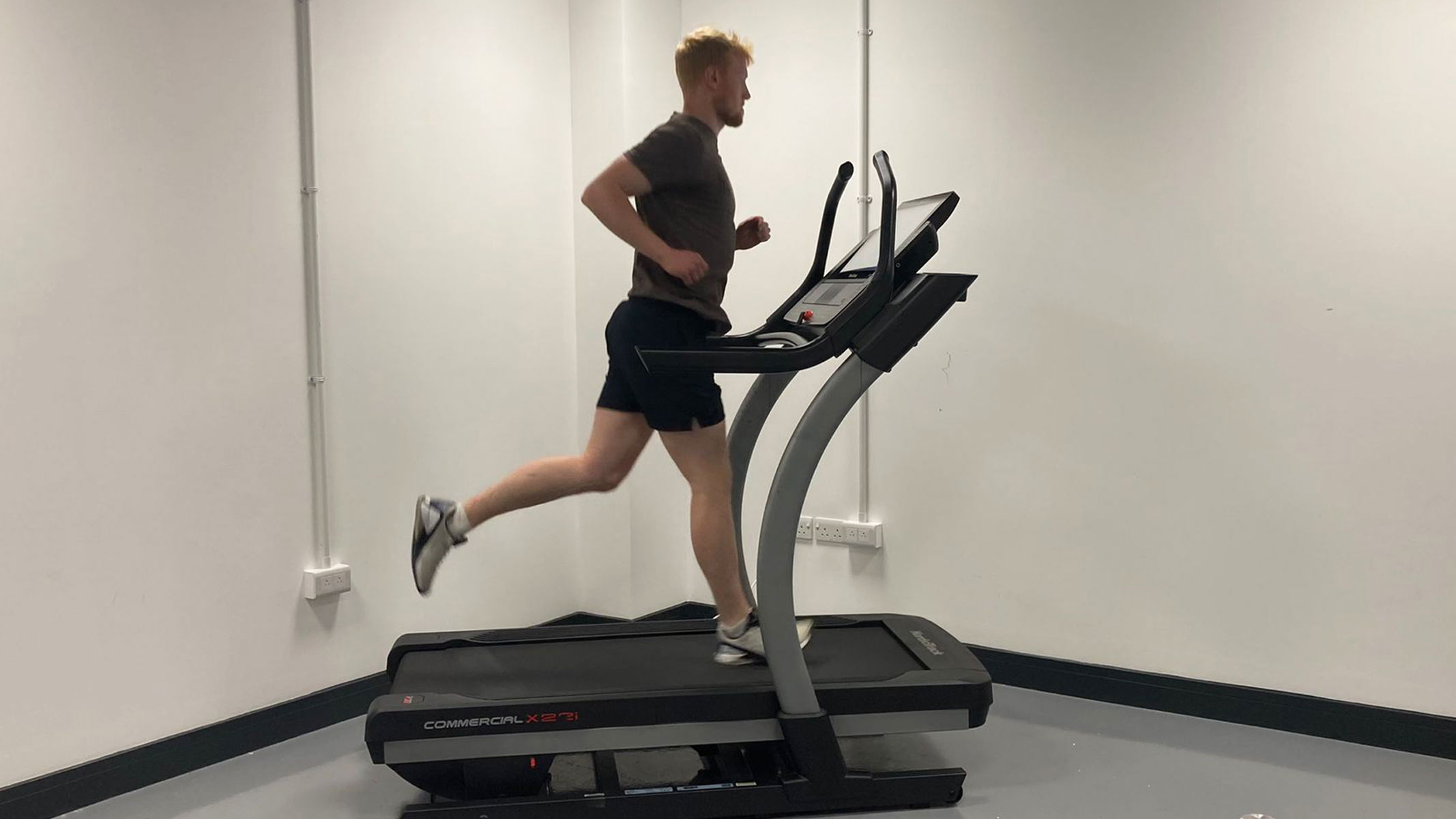 Our expert fitness reviewer testing the NordicTrack x22i treadmill