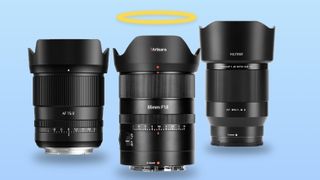 Three prime lenses from 7Artisans, TTArtisans and Viltrox against a sky-blue background, the centre lens has a halo above it 