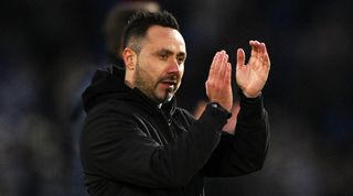 Roberto De Zerbi applauds the fans after Brighton's game against Crystal Palace in February 2024.